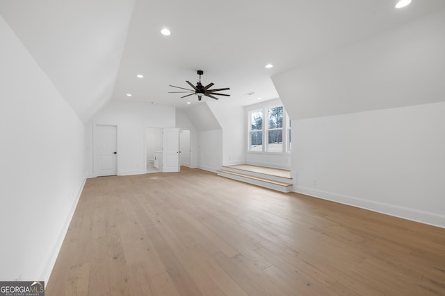 bonus room with recessed lighting, vaulted ceiling, light wood-style flooring, and baseboards