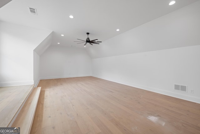 bonus room with visible vents, vaulted ceiling, light wood finished floors, and ceiling fan