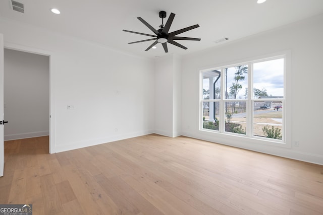 empty room with visible vents, baseboards, a ceiling fan, light wood-style floors, and recessed lighting