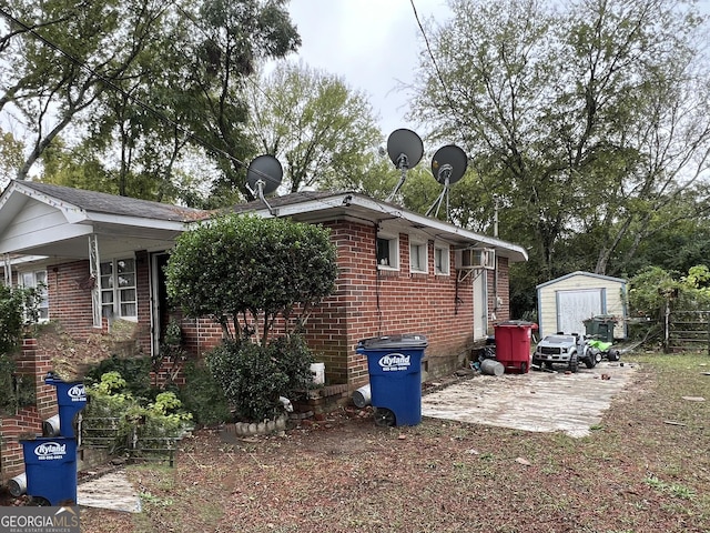 view of home's exterior featuring a shed