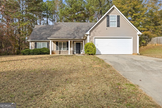 view of front of property featuring a front lawn and a garage