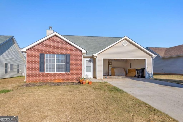 view of front of property featuring a garage and a front lawn