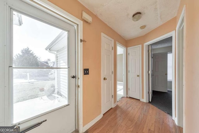 hallway featuring light wood-type flooring