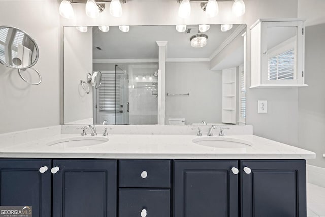 bathroom with vanity, a shower with shower door, and ornamental molding