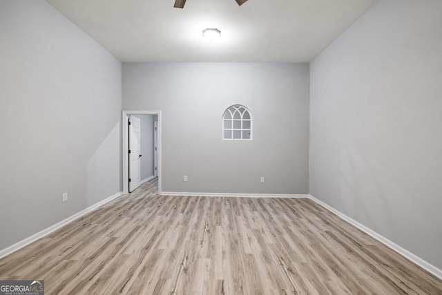 unfurnished room with ceiling fan and light hardwood / wood-style floors