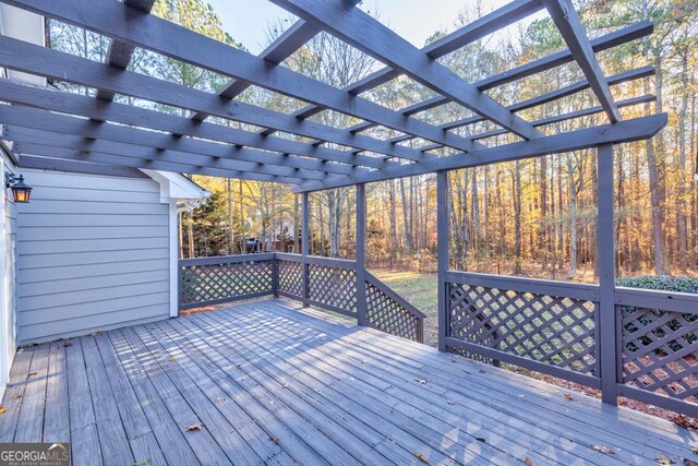 wooden deck featuring a pergola