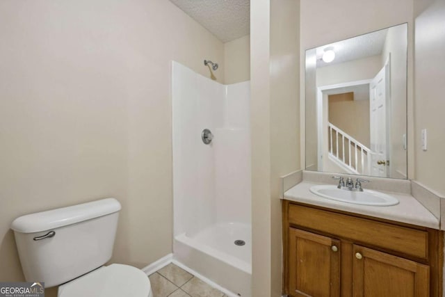 bathroom featuring walk in shower, tile patterned floors, a textured ceiling, toilet, and vanity