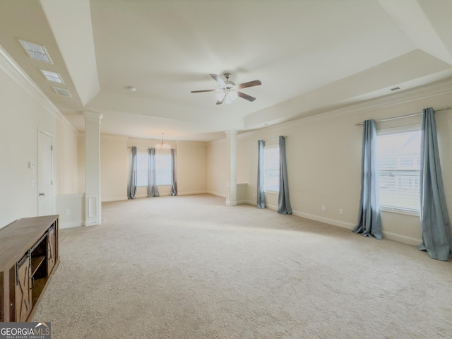 spare room featuring crown molding, carpet, and ceiling fan with notable chandelier