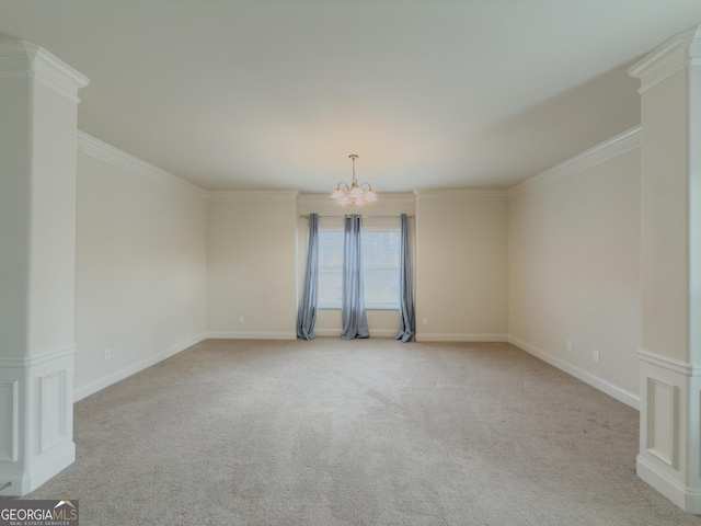 empty room featuring light colored carpet, ornamental molding, and an inviting chandelier