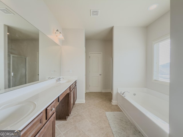 bathroom featuring tile patterned floors, vanity, and independent shower and bath