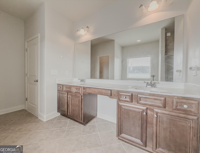 bathroom featuring tile patterned floors, vanity, and walk in shower