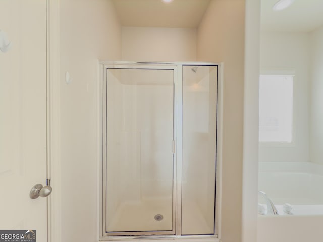 bathroom with independent shower and bath