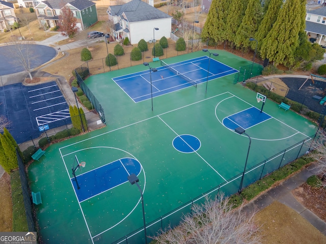 view of basketball court featuring tennis court