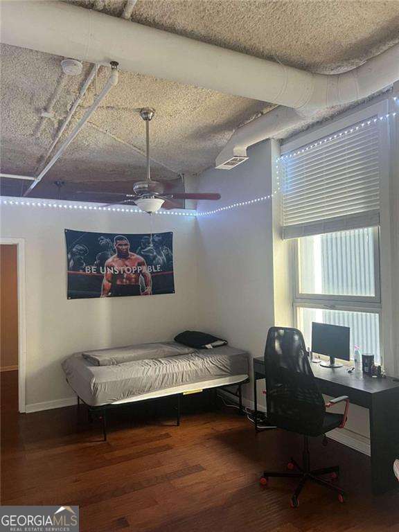 bedroom featuring hardwood / wood-style flooring