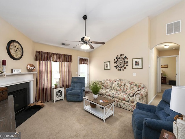 living room featuring ceiling fan and light colored carpet