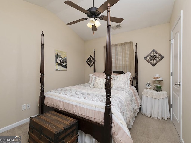 carpeted bedroom featuring ceiling fan and vaulted ceiling