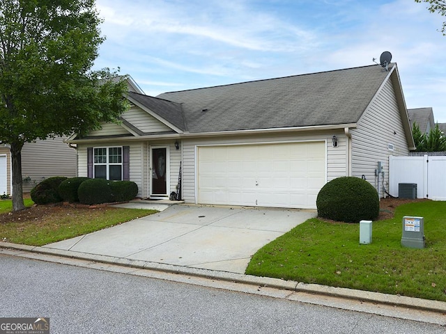 single story home with a front lawn, a garage, and central AC unit