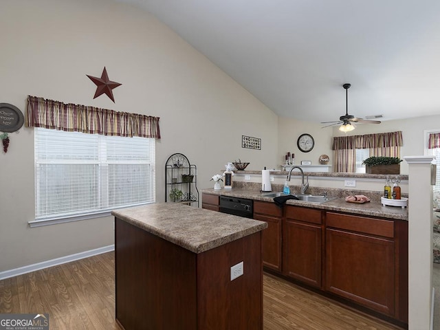 kitchen with ceiling fan, a center island, sink, dark wood-type flooring, and black dishwasher