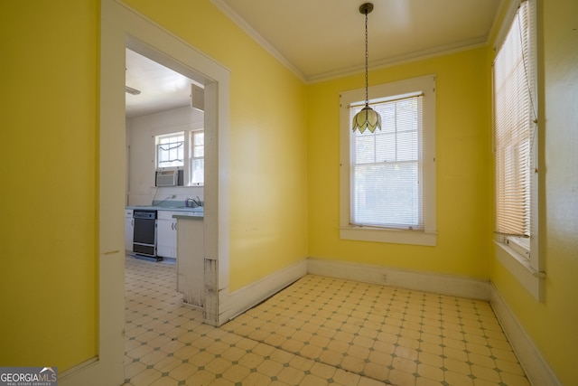 unfurnished dining area with crown molding and sink