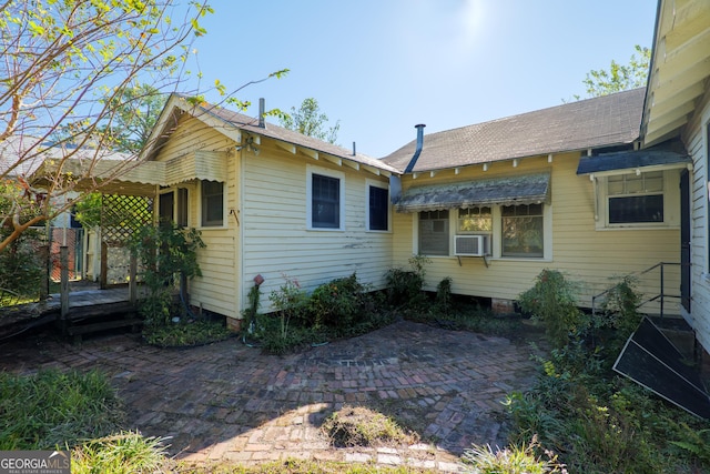 back of house with cooling unit and a patio