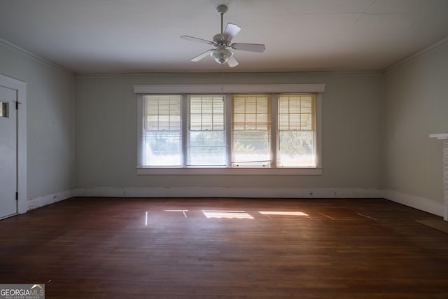 empty room featuring ceiling fan, dark hardwood / wood-style flooring, and crown molding