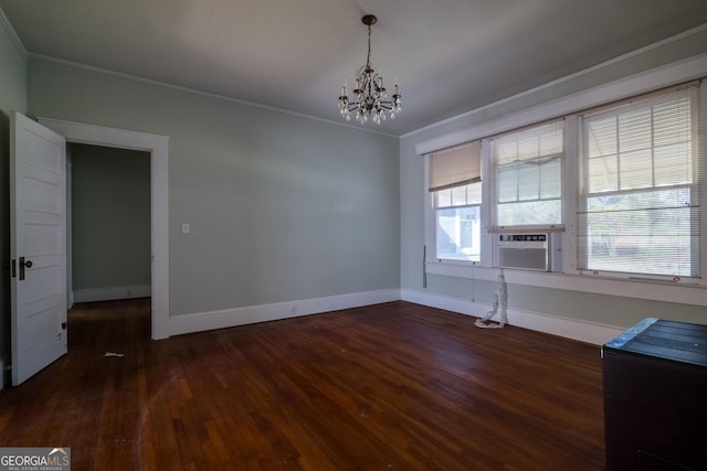 unfurnished dining area featuring a notable chandelier, dark hardwood / wood-style floors, and crown molding