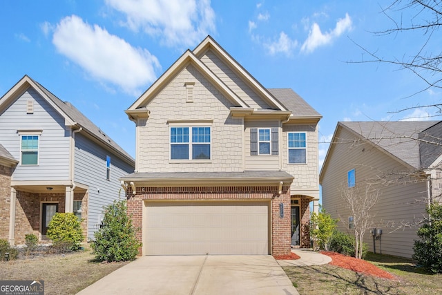 craftsman inspired home featuring a garage, concrete driveway, and brick siding