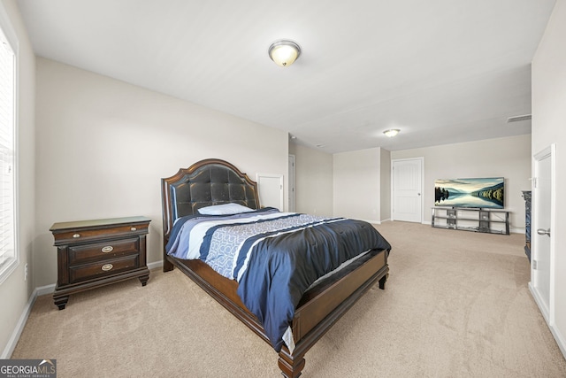 bedroom featuring carpet flooring, visible vents, and baseboards