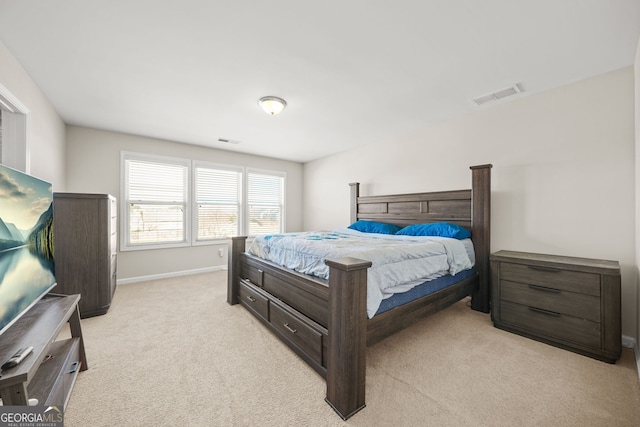 bedroom featuring light carpet, baseboards, and visible vents