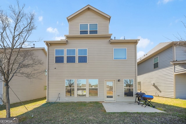 back of property with a patio and a lawn