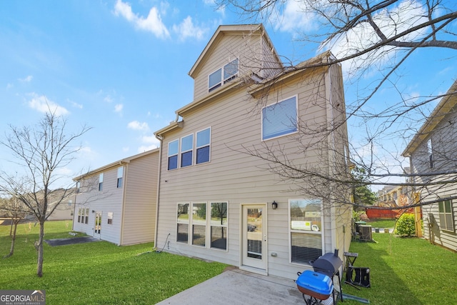 rear view of house with central AC, a lawn, and a patio