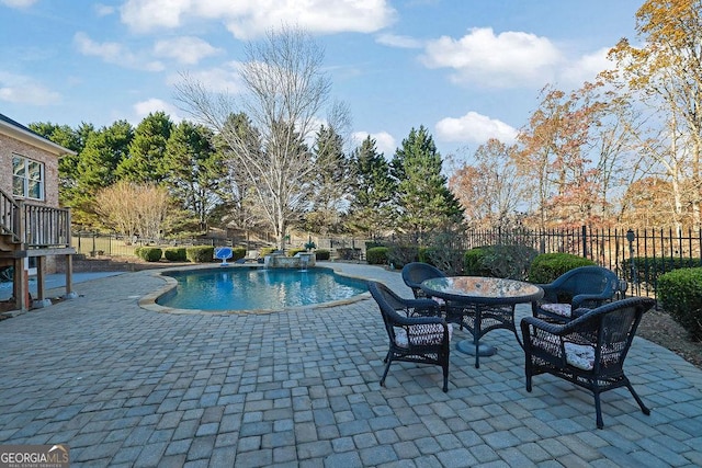 view of pool featuring a patio area