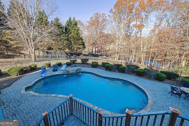 view of swimming pool featuring a patio