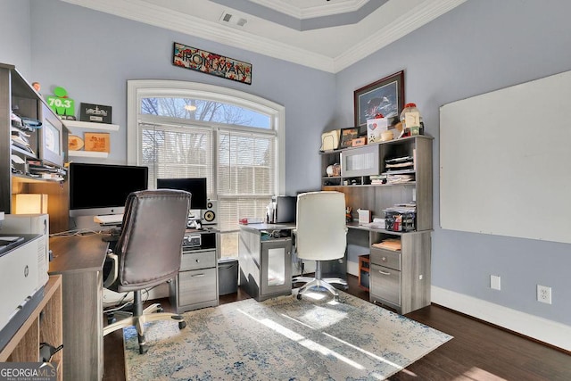 home office with a raised ceiling, dark hardwood / wood-style flooring, and crown molding