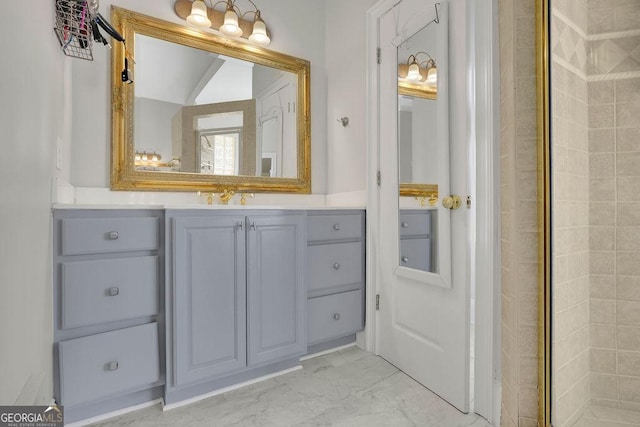 bathroom with vanity and an enclosed shower