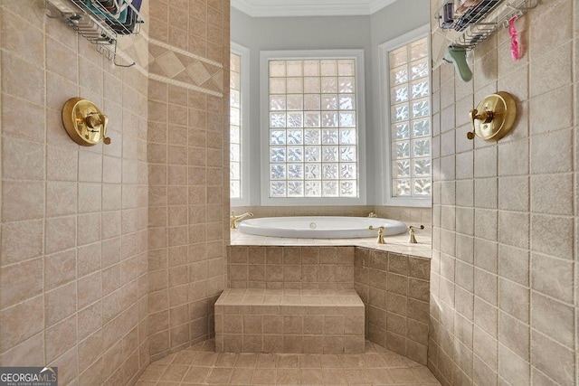 bathroom with a relaxing tiled tub and ornamental molding