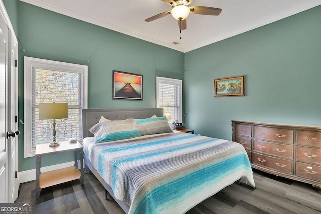 bedroom featuring hardwood / wood-style flooring, ceiling fan, and crown molding