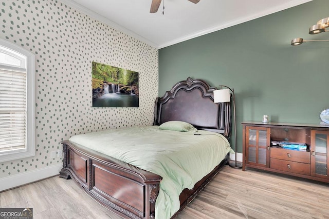 bedroom with ceiling fan, crown molding, and light hardwood / wood-style floors