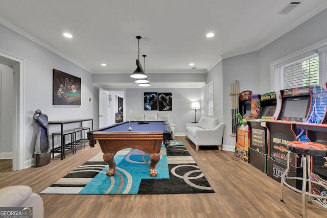 rec room featuring light wood-type flooring, ornamental molding, and pool table