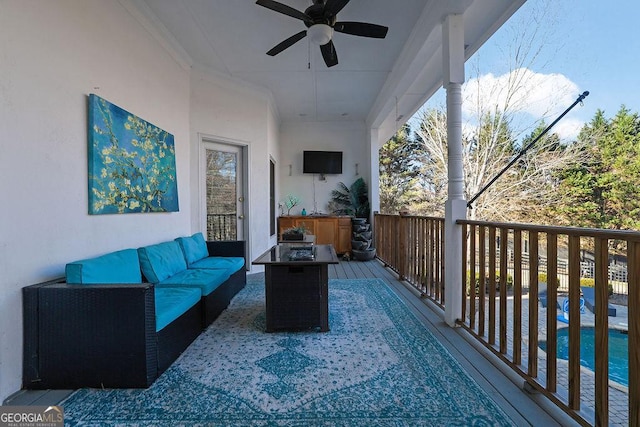 exterior space featuring an outdoor living space and ceiling fan