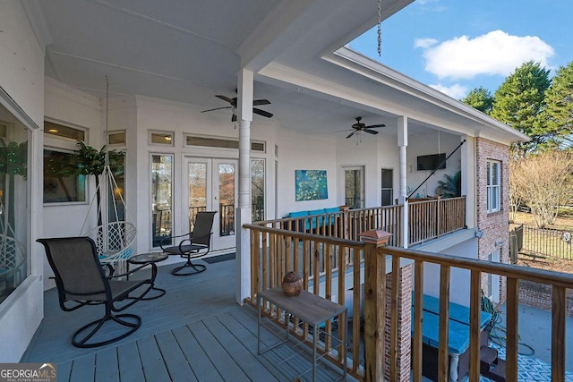 wooden deck featuring ceiling fan