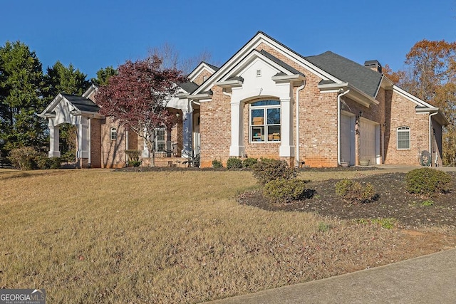 view of front facade featuring a garage and a front lawn