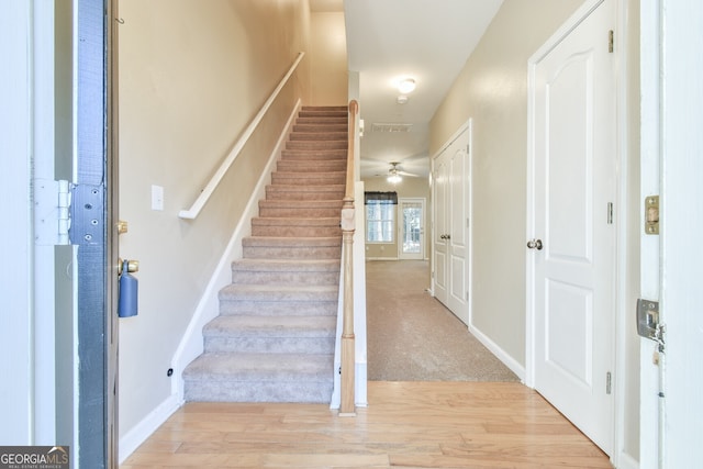 foyer featuring ceiling fan and light hardwood / wood-style floors