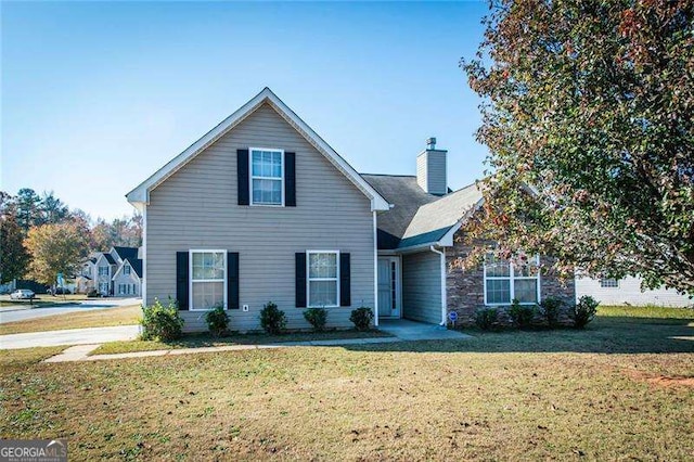 view of property with a front lawn