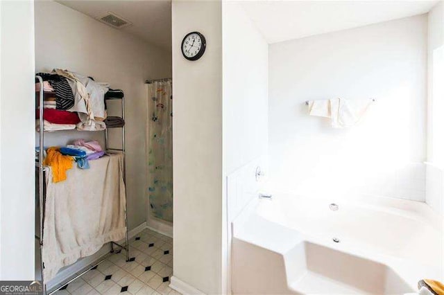 bathroom with separate shower and tub