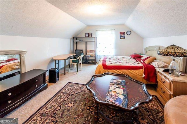 carpeted bedroom featuring vaulted ceiling and a textured ceiling