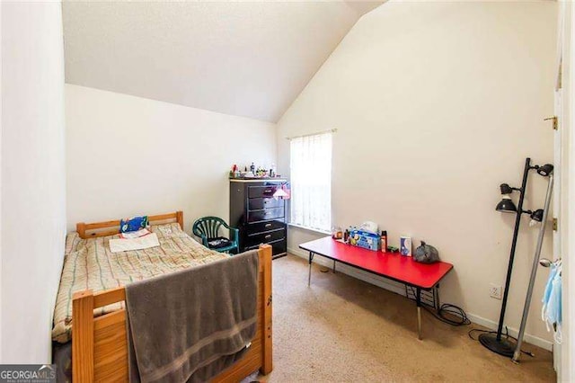 bedroom with carpet flooring and vaulted ceiling