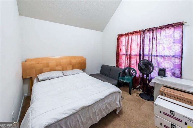 bedroom featuring light colored carpet and vaulted ceiling