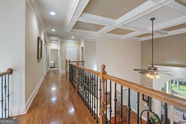 corridor with hardwood / wood-style flooring, ornamental molding, beamed ceiling, and coffered ceiling