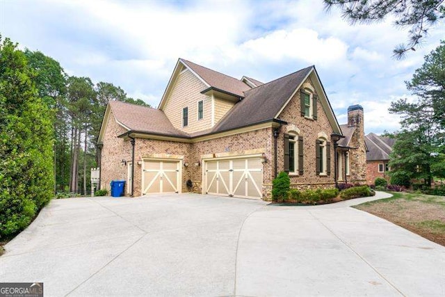 view of side of property with a garage